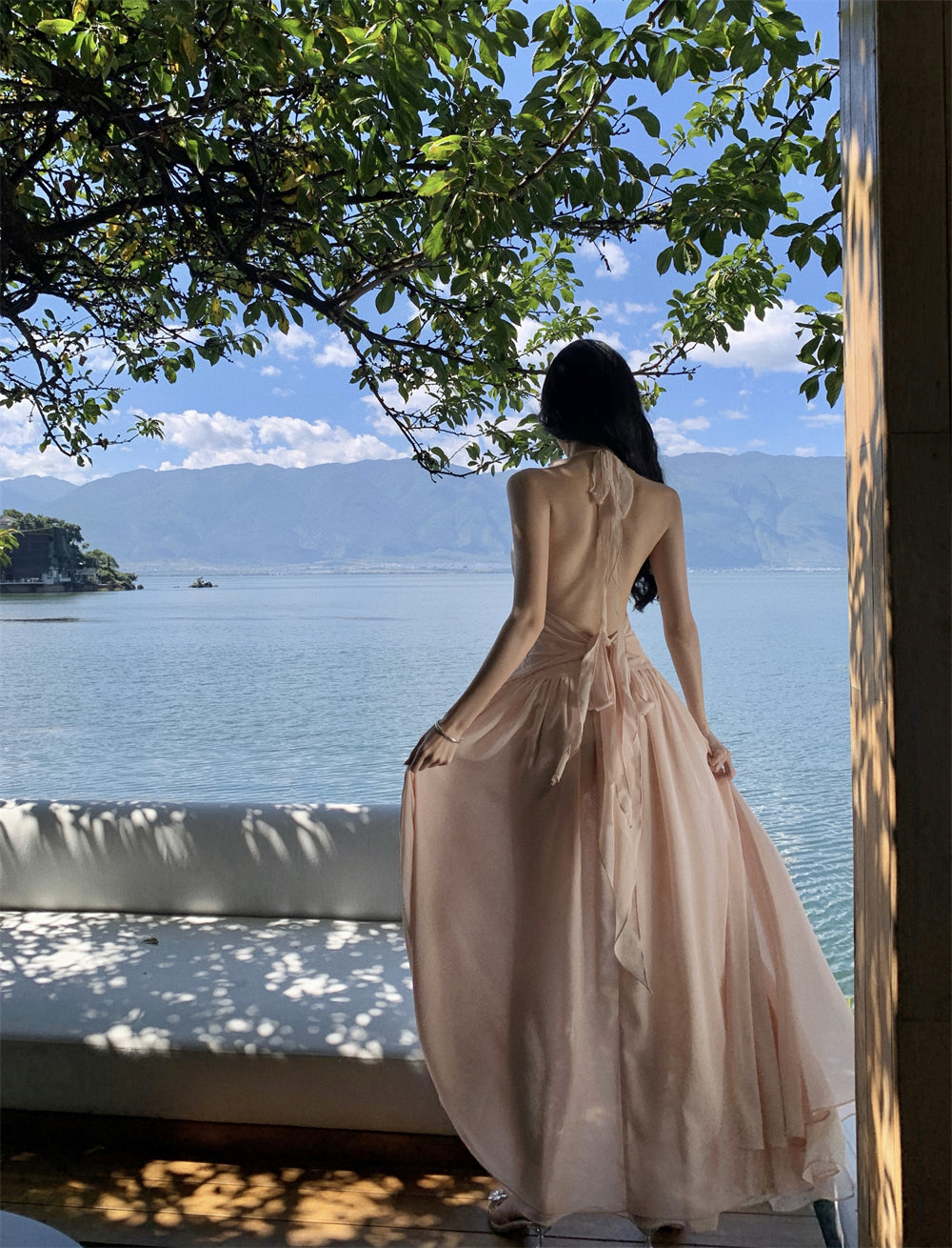 Seaside vacation beauty God descending sleeveless V-neck neckline dress new gentle temperament wooden ear edge backless long skirt