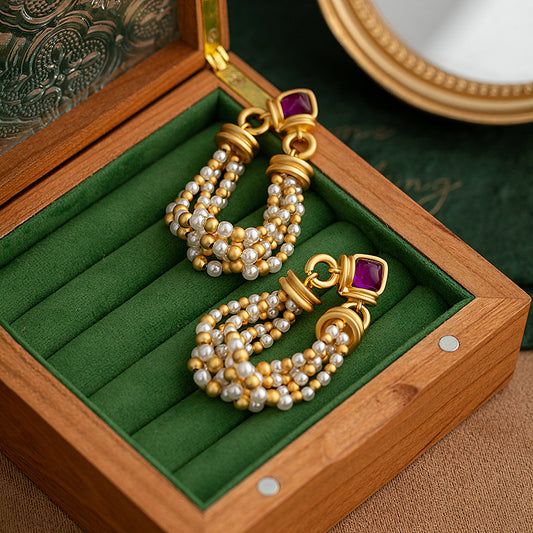 Pearl tassel earrings female niche fashion creative design earrings 925 silver needle temperament senior sense of ear jewelry